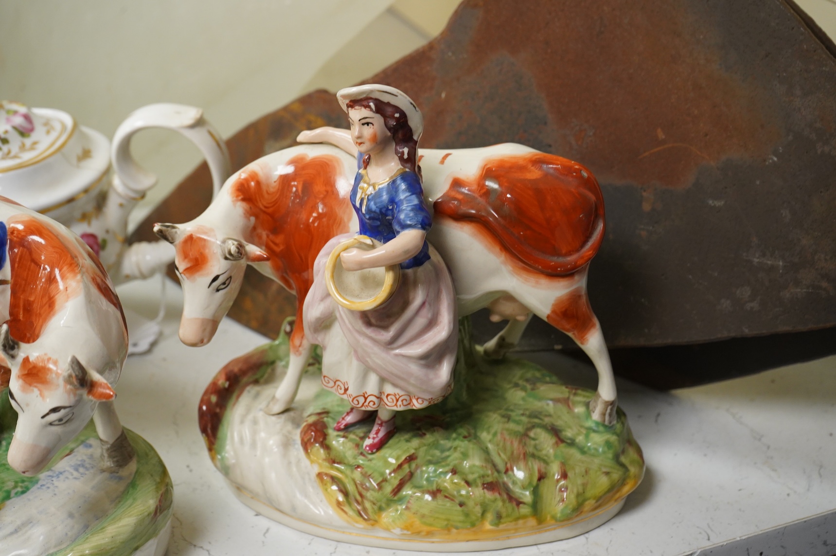 An early 19th century Derby three piece tea service, A pair of Staffordshire cow groups, Wedgwood etc